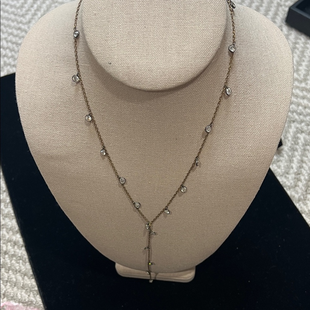 Goldtone “Y” necklace with crystal beveled stones.
